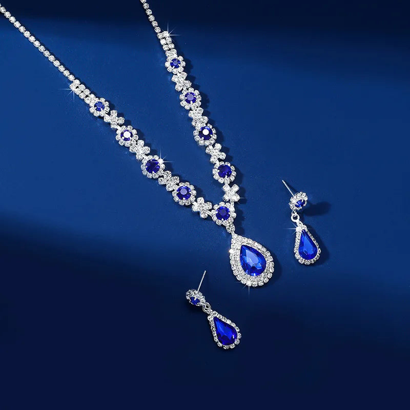 Elegant waterdrop rhinestone jewelry set featuring necklace and earrings in blue and silver for women.