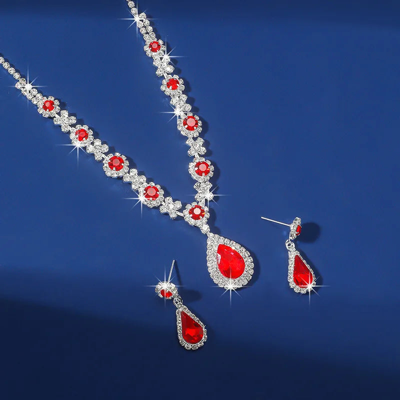 Elegant waterdrop rhinestone jewelry set featuring red gemstones, including necklace and earrings, perfect for women.