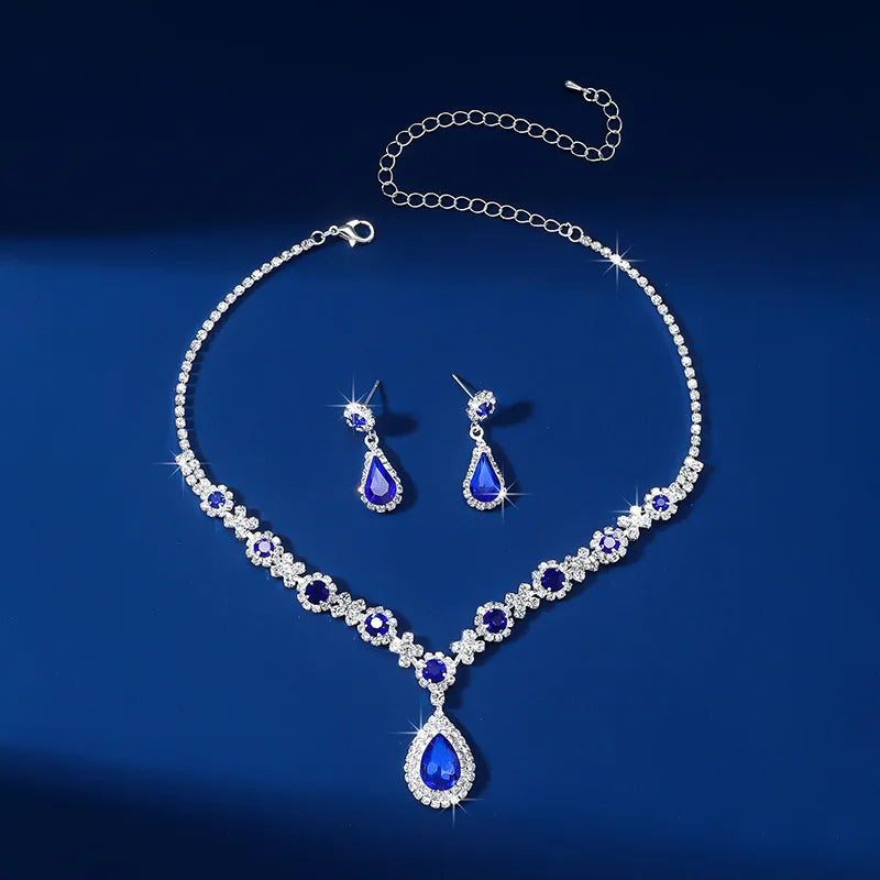 Elegant waterdrop rhinestone jewelry set featuring necklace and earrings in blue and silver, perfect for weddings.